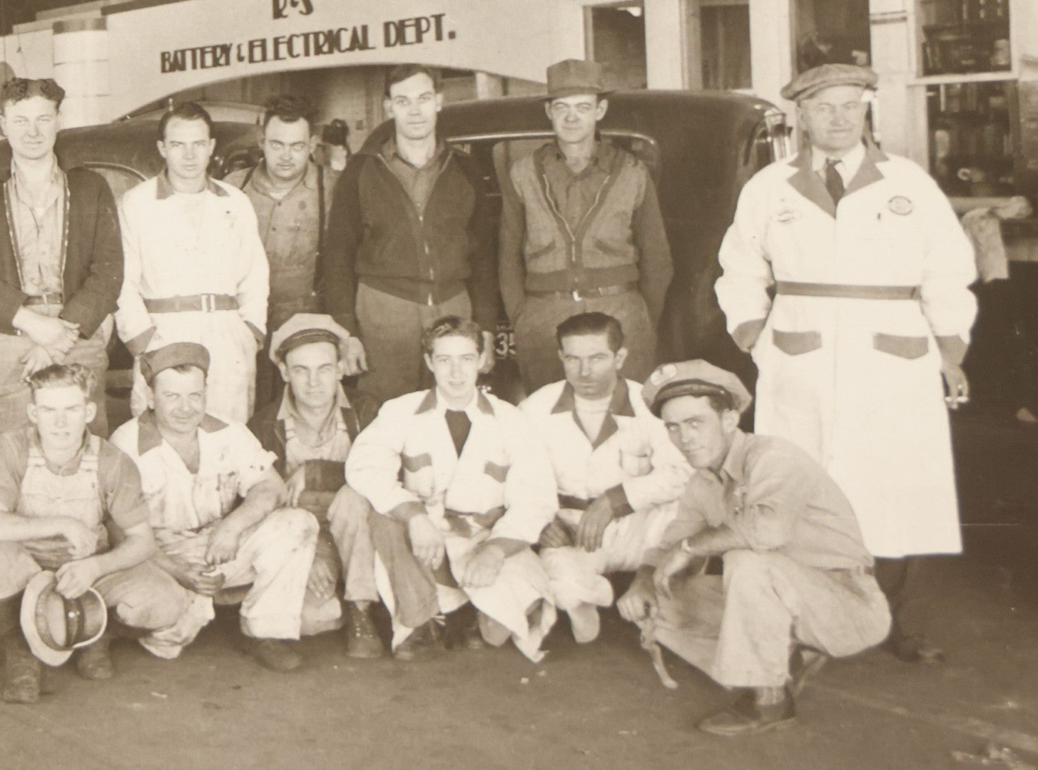 Lot 145 - Vintage Boarded Occupational Photograph Of Mechanics And Workers At A Chevrolet Dealership And Sales Room, Photo Taken On November 13, 1941, Photographed On Eastman Kodak Safety Film