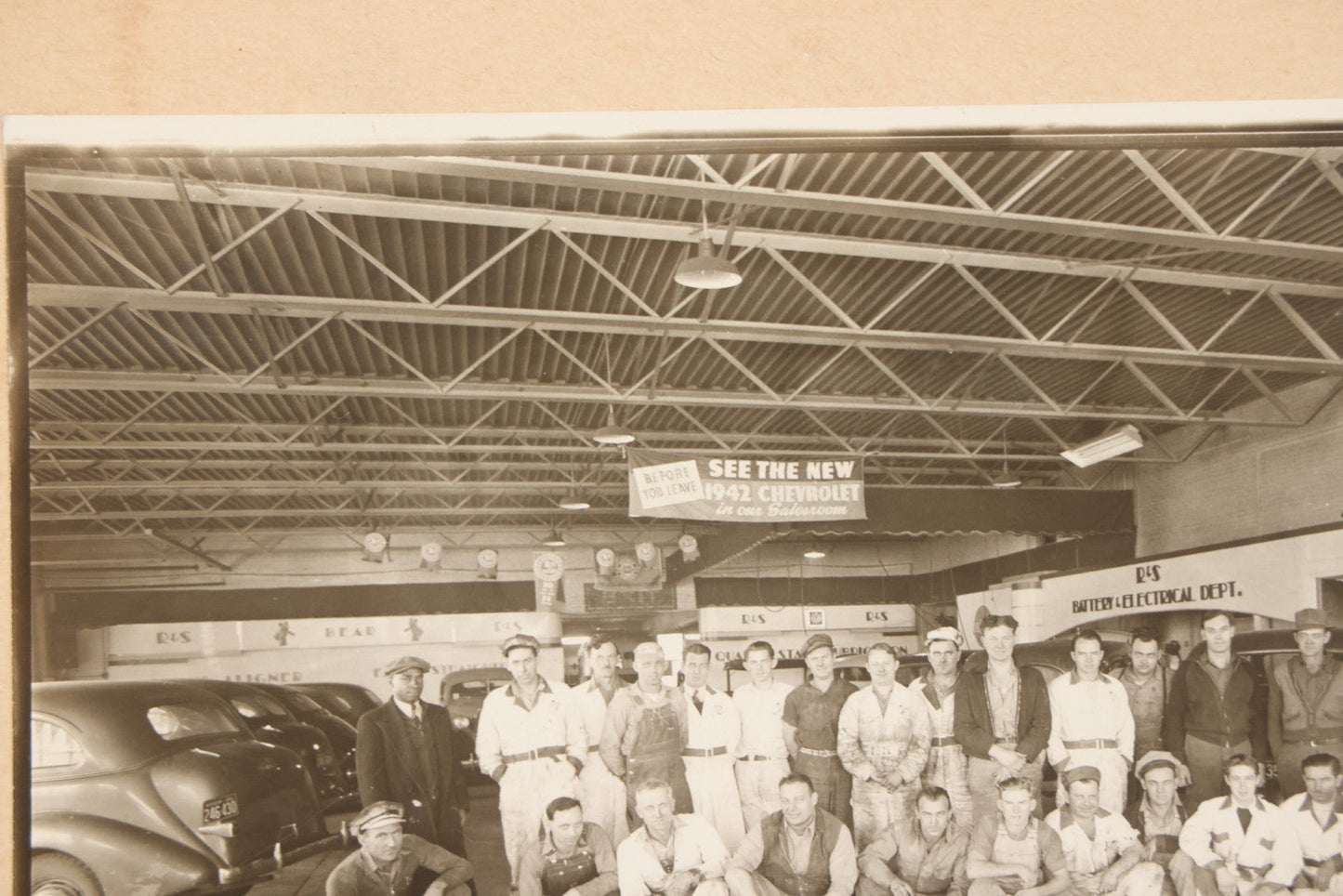 Lot 145 - Vintage Boarded Occupational Photograph Of Mechanics And Workers At A Chevrolet Dealership And Sales Room, Photo Taken On November 13, 1941, Photographed On Eastman Kodak Safety Film