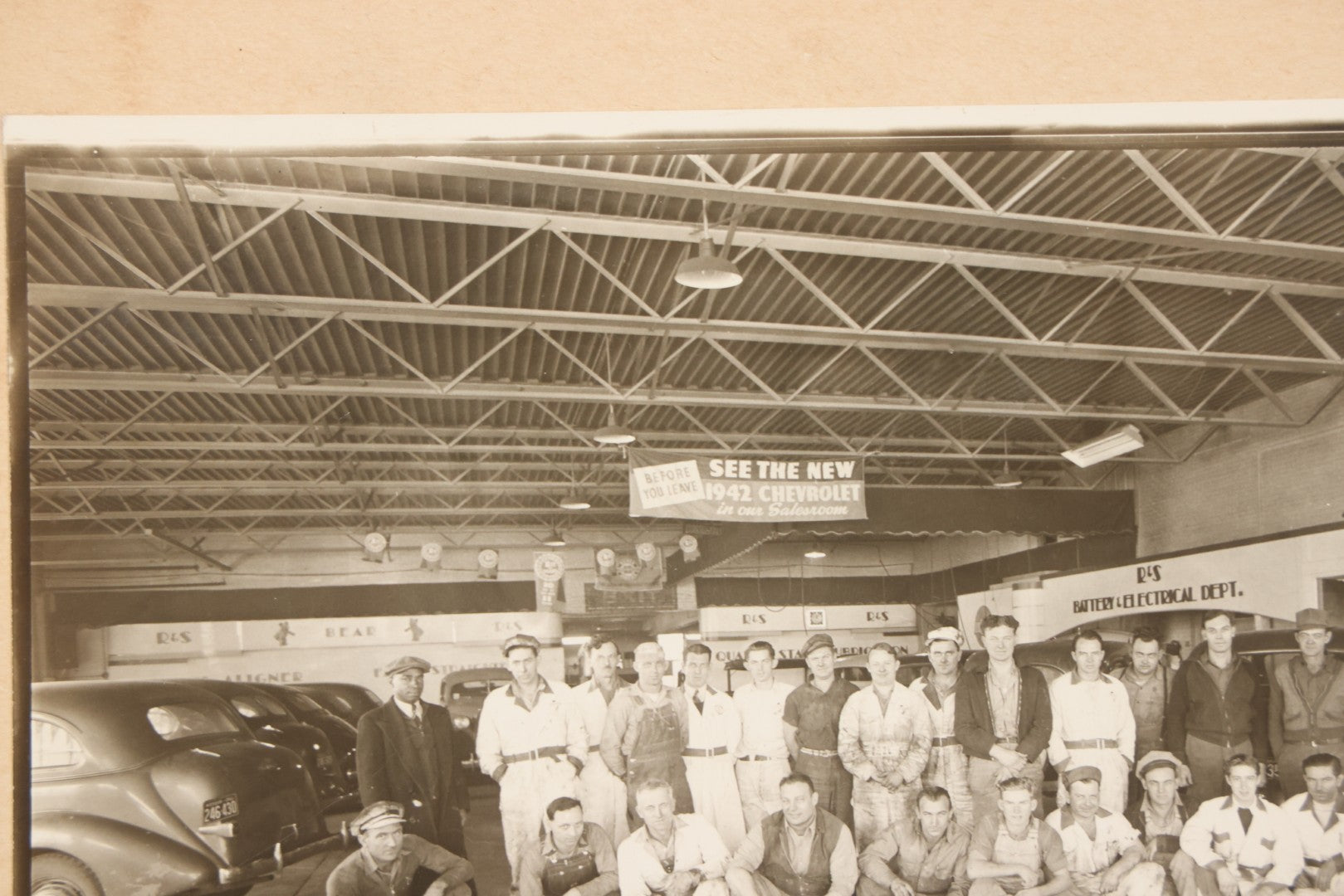 Lot 145 - Vintage Boarded Occupational Photograph Of Mechanics And Workers At A Chevrolet Dealership And Sales Room, Photo Taken On November 13, 1941, Photographed On Eastman Kodak Safety Film
