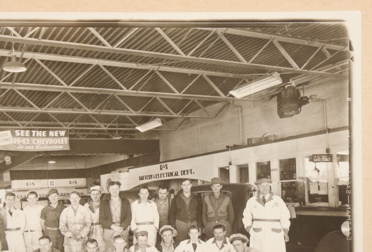 Lot 145 - Vintage Boarded Occupational Photograph Of Mechanics And Workers At A Chevrolet Dealership And Sales Room, Photo Taken On November 13, 1941, Photographed On Eastman Kodak Safety Film