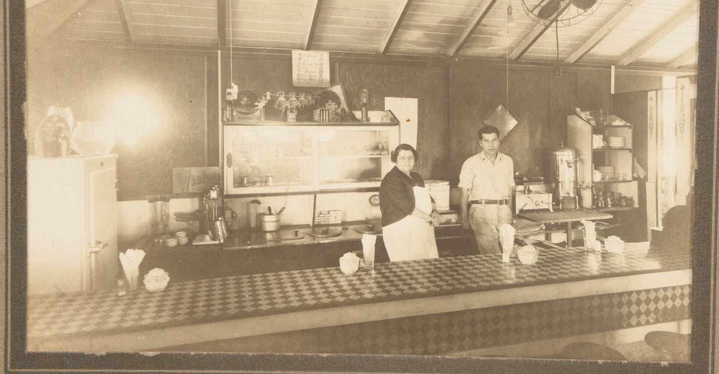 Lot 150 - Vintage Occupational Photograph In Paper Slip Frame Of Man And Woman Working The Counter At A Diner, Identified As "Grandma" And Henry