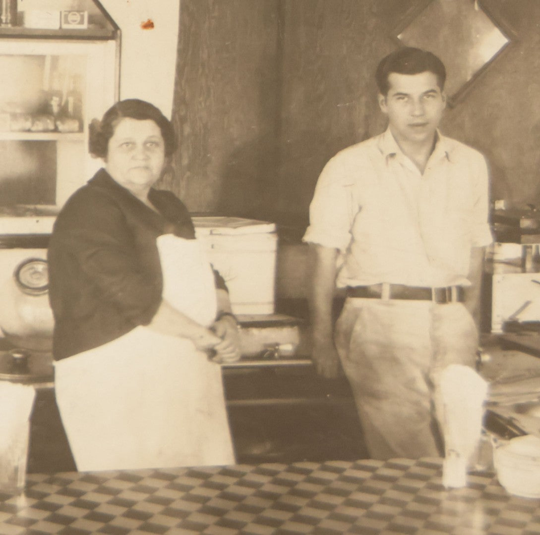 Lot 150 - Vintage Occupational Photograph In Paper Slip Frame Of Man And Woman Working The Counter At A Diner, Identified As "Grandma" And Henry