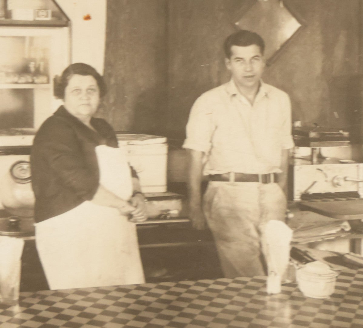 Lot 150 - Vintage Occupational Photograph In Paper Slip Frame Of Man And Woman Working The Counter At A Diner, Identified As "Grandma" And Henry