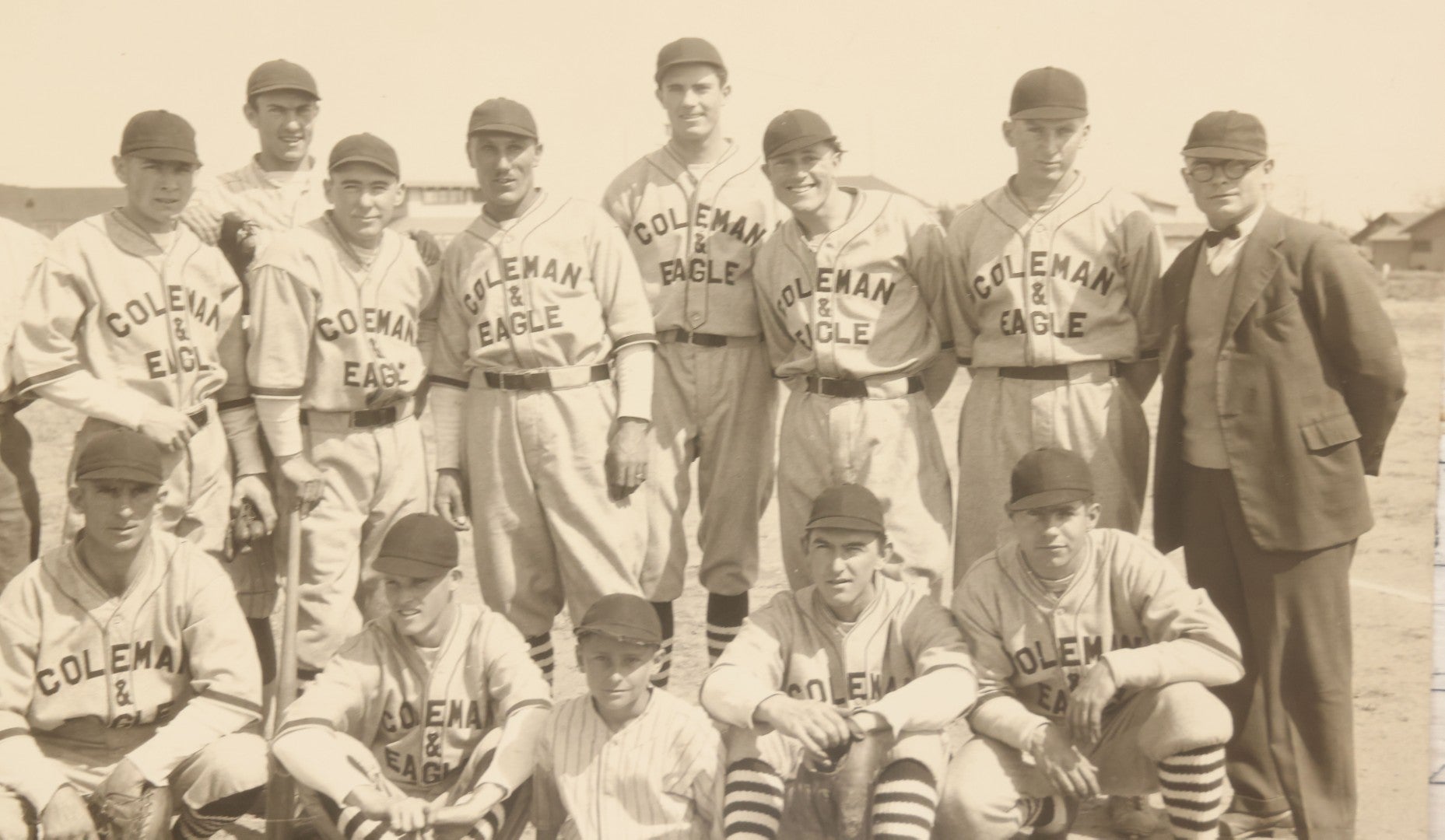 Lot 151 - Vintage Unmounted Large Format Photograph Of Coleman & Eagle Baseball Team In Uniforms Posing With Coaches And Ballboy, Wearing Very Stylish Striped Socks, Note Loss To Bottom Left