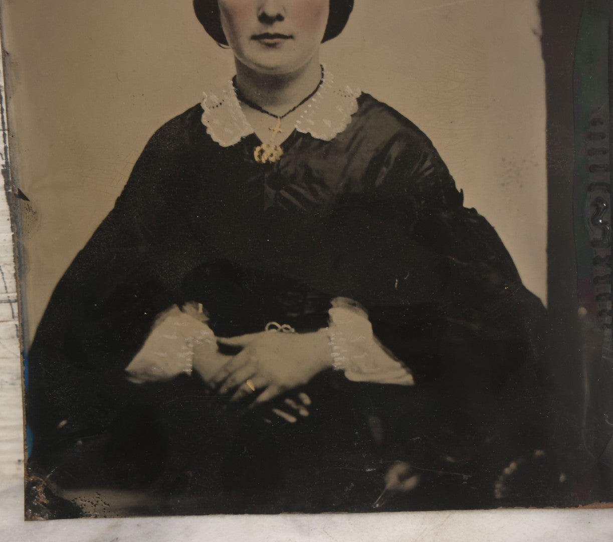 Lot 171 - Antique Full Plate Tintype Photograph Of A Young Woman With Center Parted Hair, Folded Hands, Gold Tinted Cross, Ring, Jewelry, White Painted Details