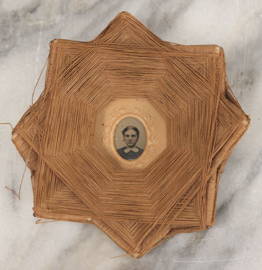 Lot 013 - Antique Folk Art String Frame With Gem Sized Tintype Of Young Woman With White Lace Collar, As Found, 4-1/2" x 4-1/2"