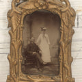 Lot 015 - Antique Tintype Photograph Of A Man And Woman Couple In Gold Painted Cast Iron Branch Frame With Flower Motif, Wire Hanger, 3-1/2" x 5-7/8"