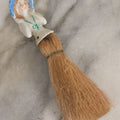 Lot 078 - Vintage Porcelain Lady With Blue Hat, Green Bow, Straw Dresser Brush, Made In Japan, Note Crack, Repair, 5-1/2" Length