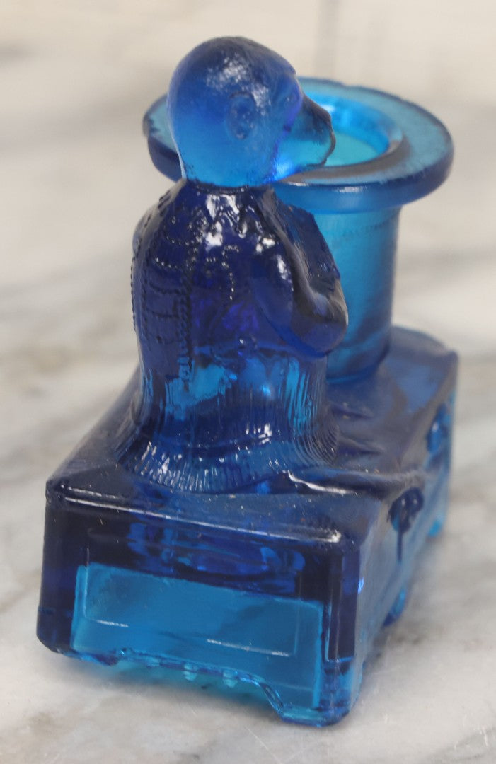 Lot 083 - Antique Molded Blue Glass Toothpick Holder With Magician Monkey Posing With Top Hat, Note Chip To Hat Rim