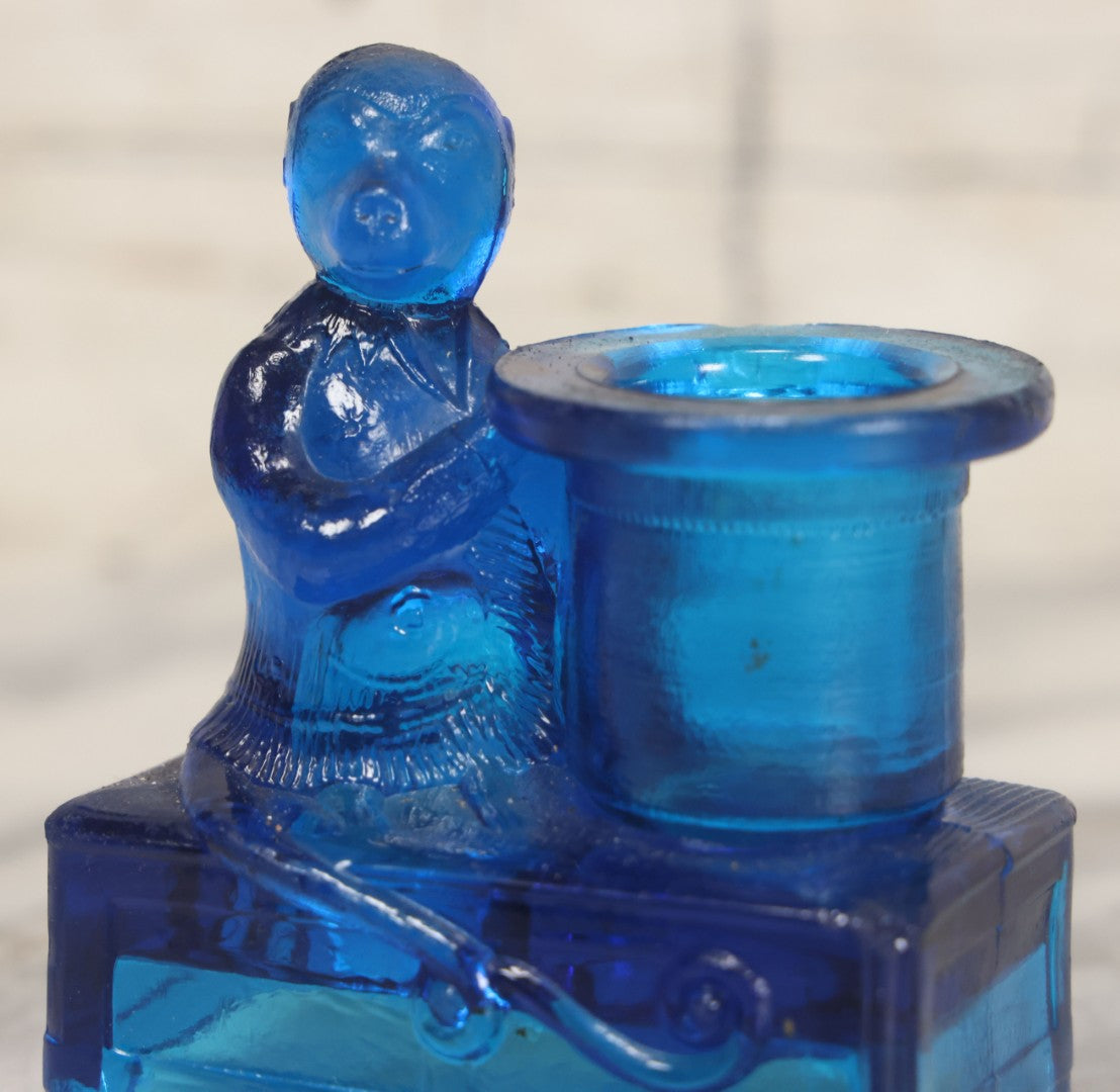 Lot 083 - Antique Molded Blue Glass Toothpick Holder With Magician Monkey Posing With Top Hat, Note Chip To Hat Rim