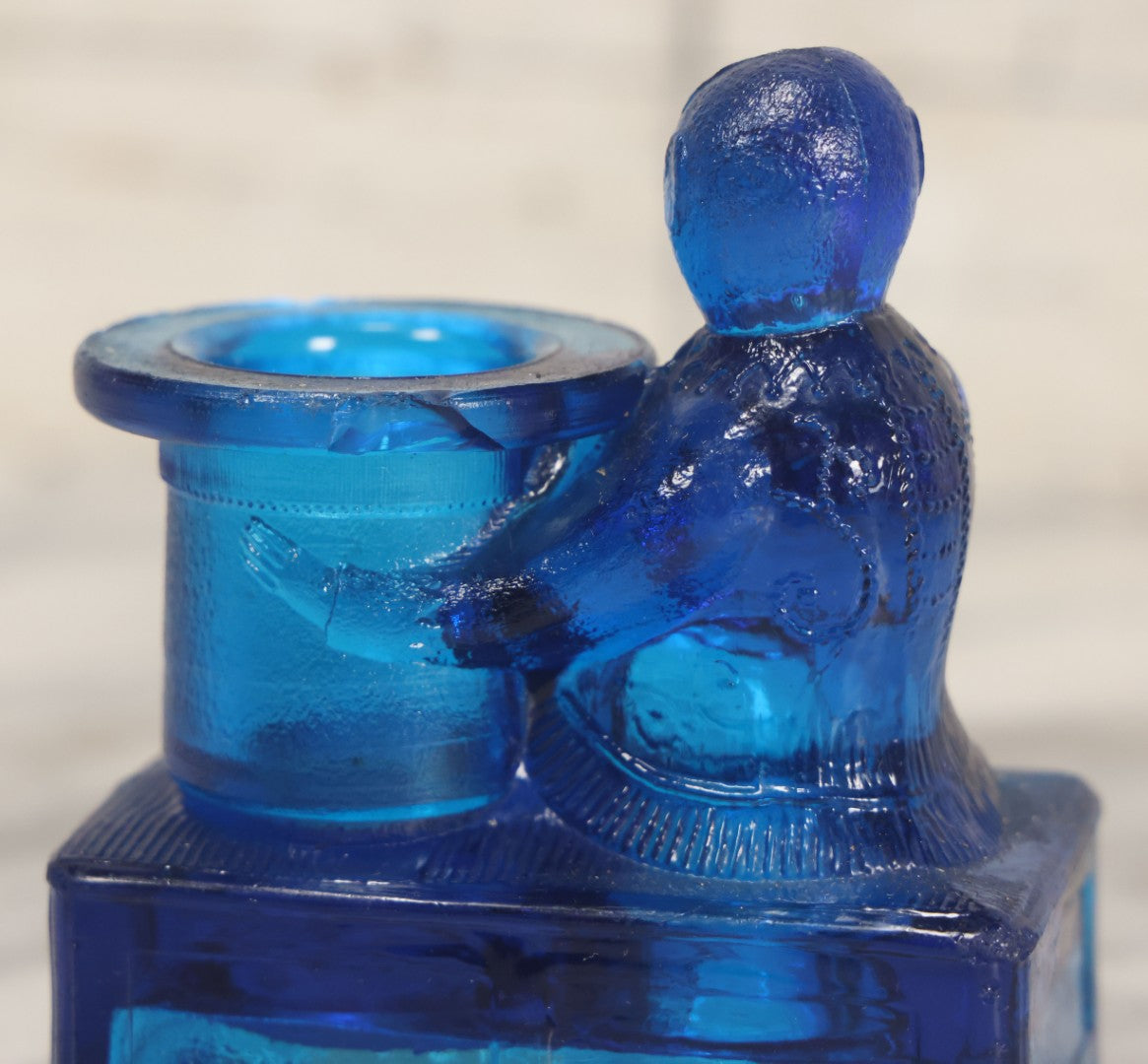Lot 083 - Antique Molded Blue Glass Toothpick Holder With Magician Monkey Posing With Top Hat, Note Chip To Hat Rim
