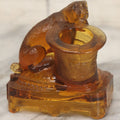 Lot 084 - Antique Molded Orange Glass Toothpick Holder With Sa Dog Resting Chin On Top Hat, Note Chips To Interior Of Hat