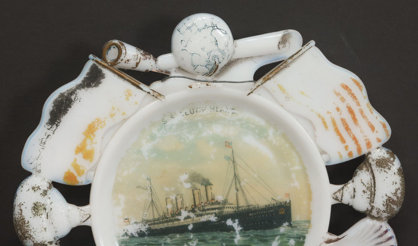 Lot 085 - Antique Milk Glass Collectible Souvenir Plate From The S.S. Deutschland, German Ocean Liner, Hamburg America Line (H.A.P.A.G.), With Lithographed Depiction Of Ship, Remnants Of Original Paint, Note Small Crack, 7-3/8" Diameter