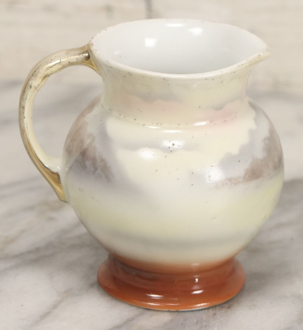 Lot 088 - Antique Royal Bayreuth Porcelain Creamer With White And Brown Cow Graphics, Painted Landscape Scene, 3-5/8" Height