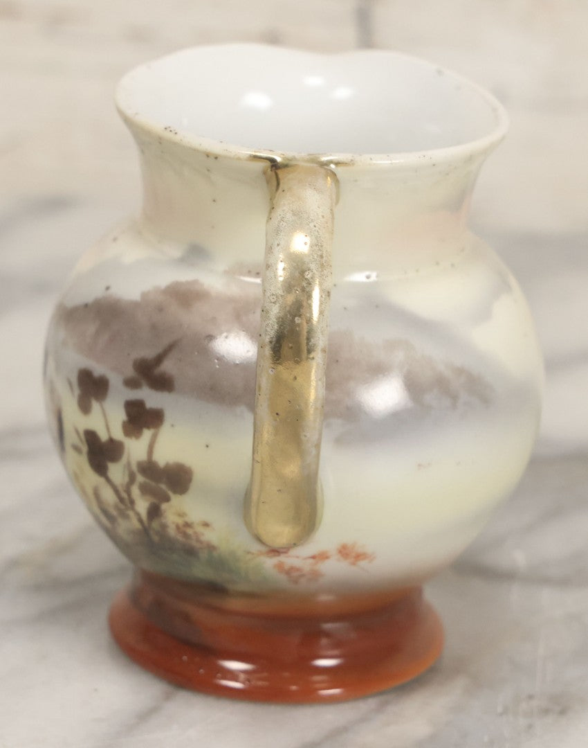 Lot 088 - Antique Royal Bayreuth Porcelain Creamer With White And Brown Cow Graphics, Painted Landscape Scene, 3-5/8" Height