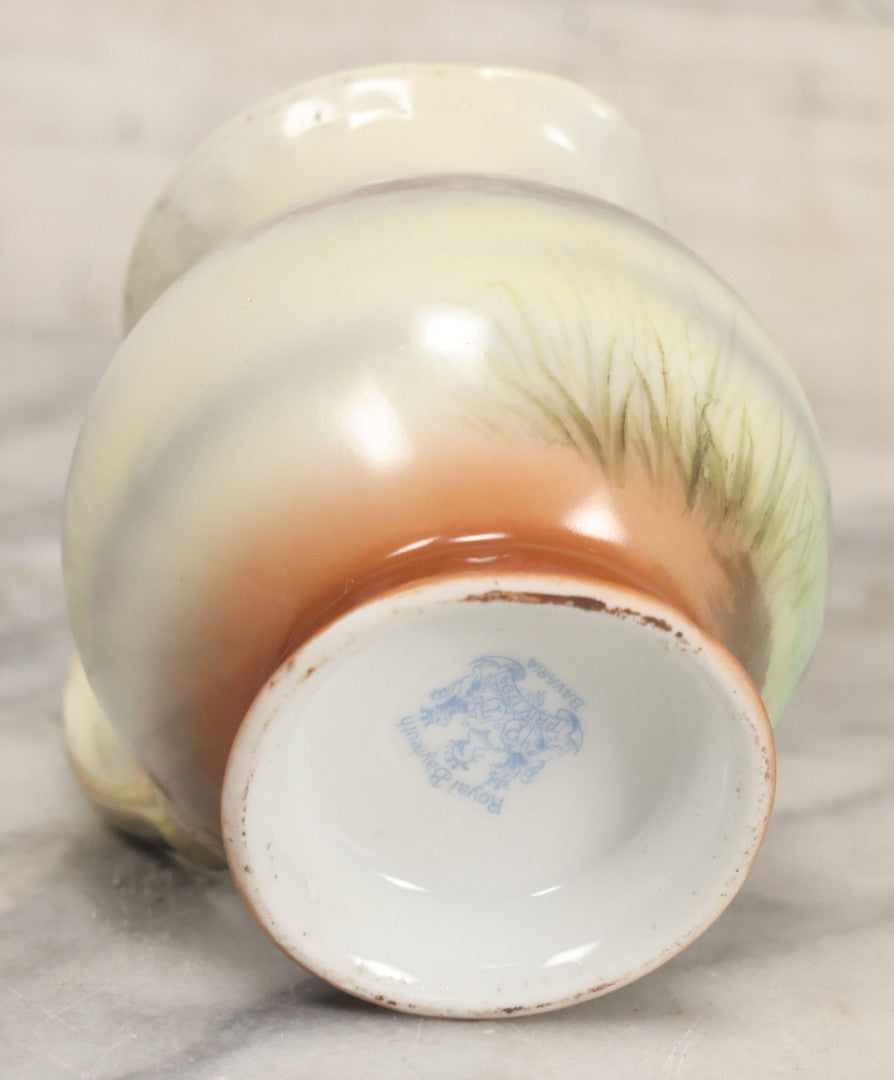 Lot 088 - Antique Royal Bayreuth Porcelain Creamer With White And Brown Cow Graphics, Painted Landscape Scene, 3-5/8" Height