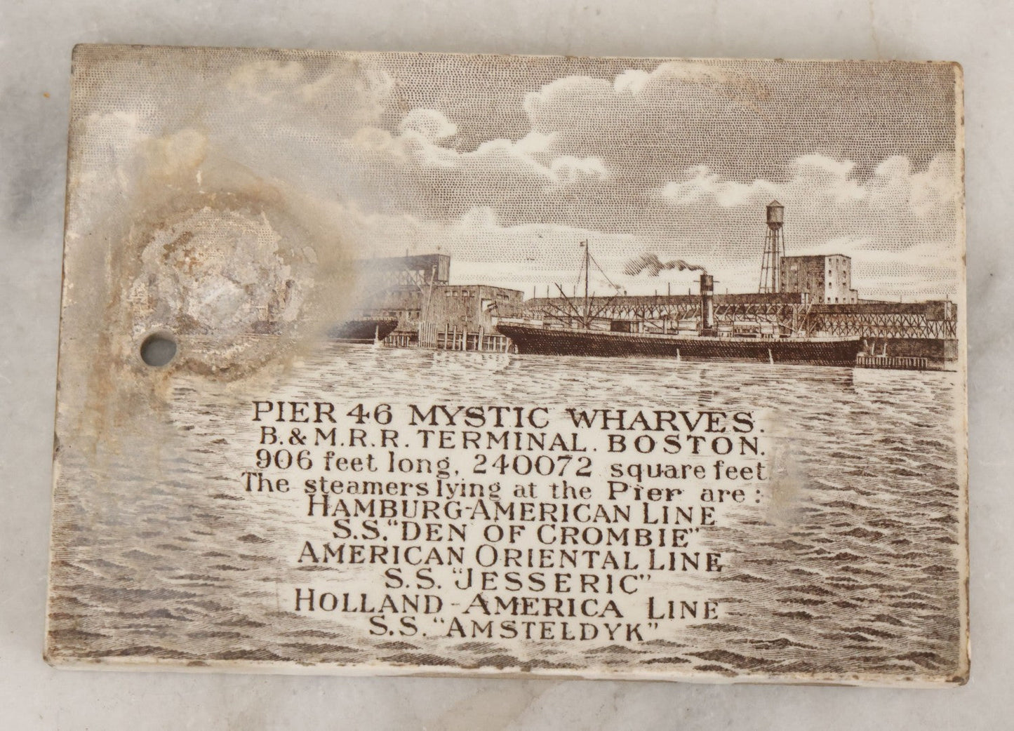 Lot 094 - Antique 1913 Calendar Tile With Image Of Pier 46 Mystic Wharves, Boston &  Maine Railroad Terminal, Boston, Advertising Jones, McDuffee & Stratton Corporation, Crockery, China, & Glass Merchants, Boston, Note Large Blemish, Left Side