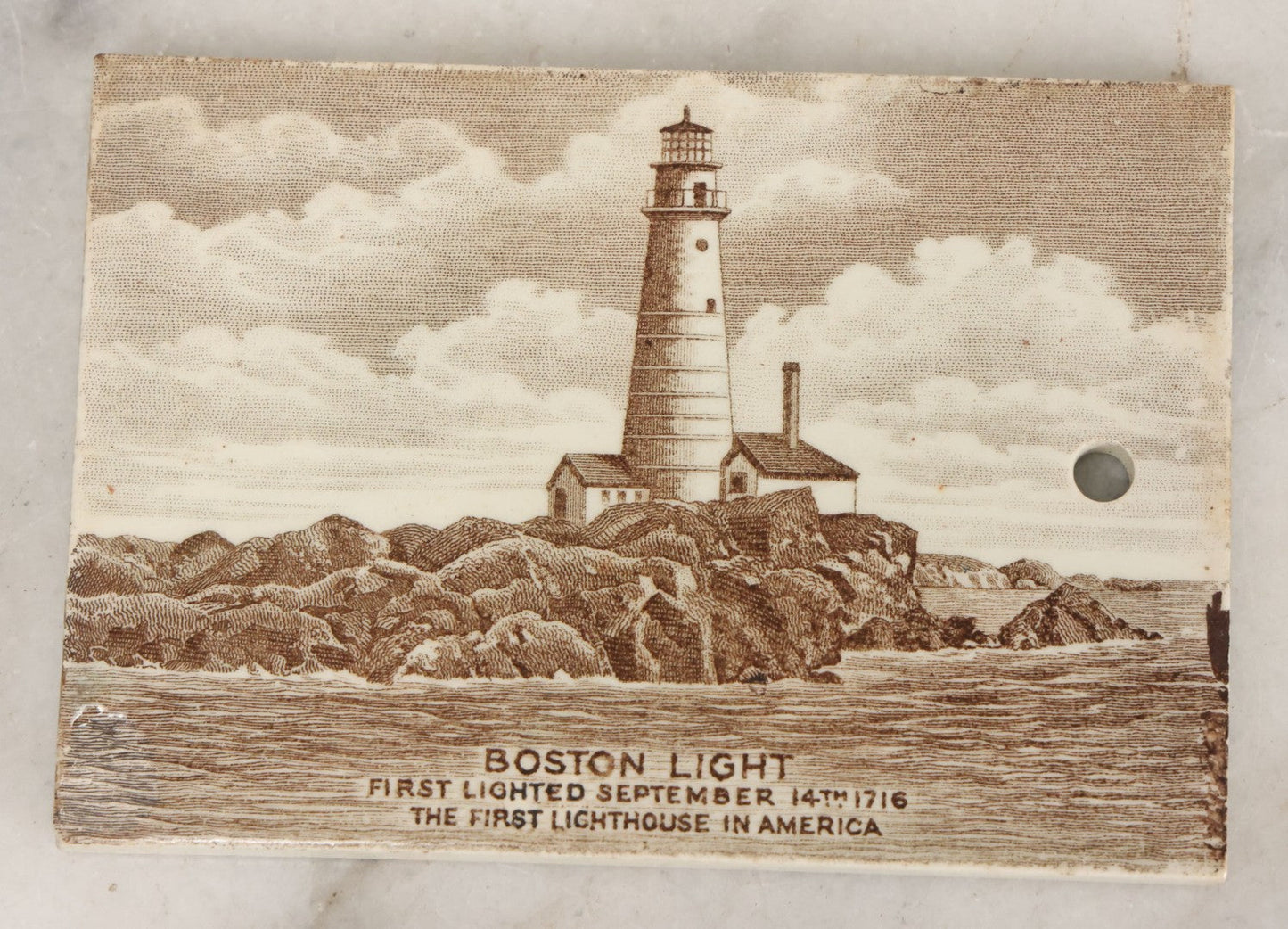 Lot 097 - Antique 1918 Calendar Tile With Image Of The Boston Light, First Lighthouse In America, Advertising Jones, McDuffee & Stratton Corporation, Crockery, China, & Glass Merchants, Boston, Manufactured By Wedgwood, Etruria, England