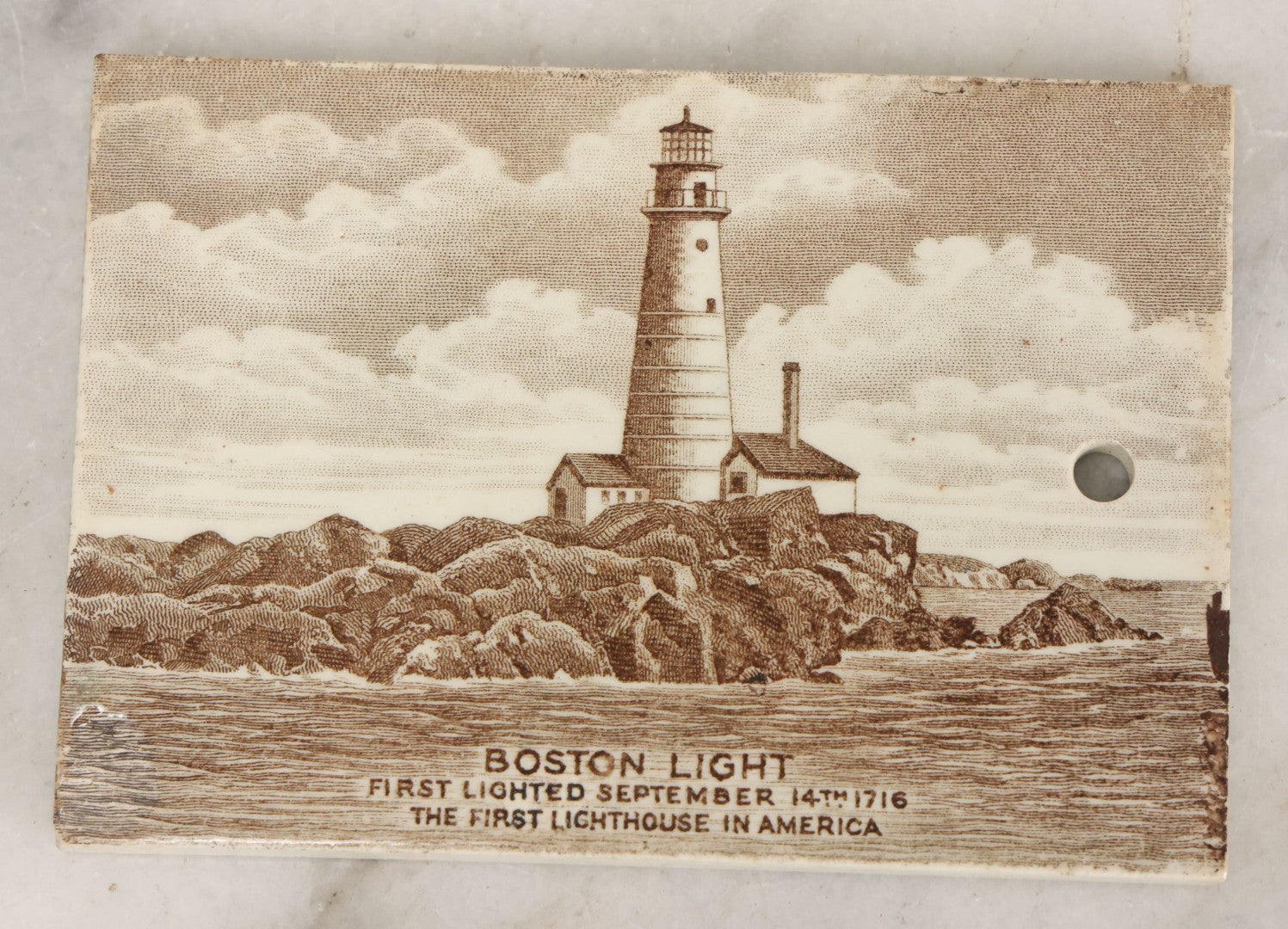 Lot 097 - Antique 1918 Calendar Tile With Image Of The Boston Light, First Lighthouse In America, Advertising Jones, McDuffee & Stratton Corporation, Crockery, China, & Glass Merchants, Boston, Manufactured By Wedgwood, Etruria, England