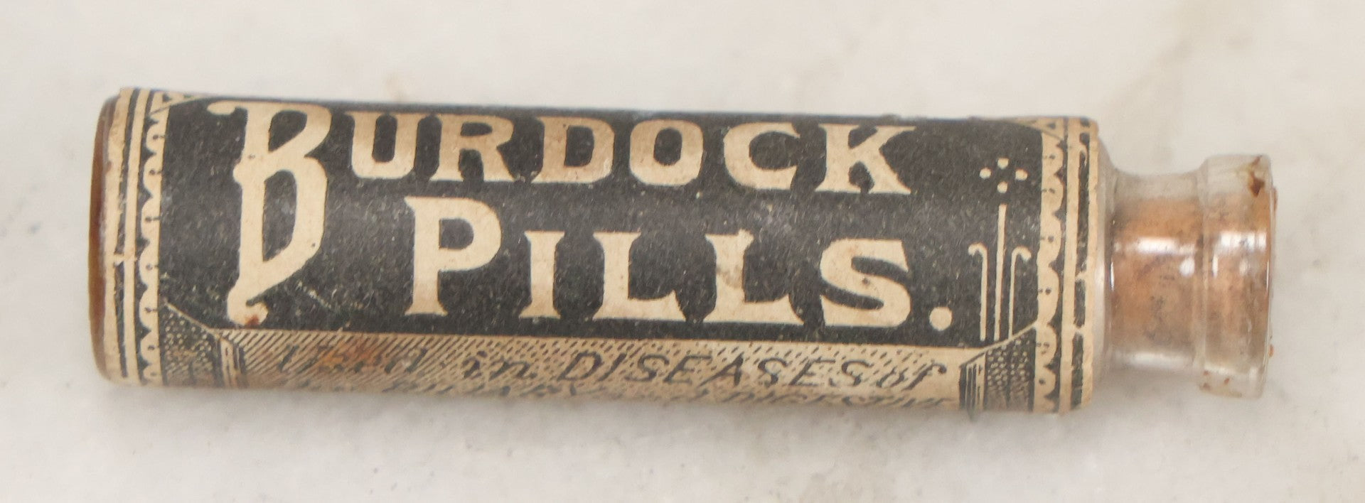 Lot 100 - Grouping Of Three Antique Medicine Pill Vials With Original Paper Labels, Corks, And Contents, Including Humphrey's Homeopathic No. 35., Burdock Pills, And Cartier's Little Liver Pills