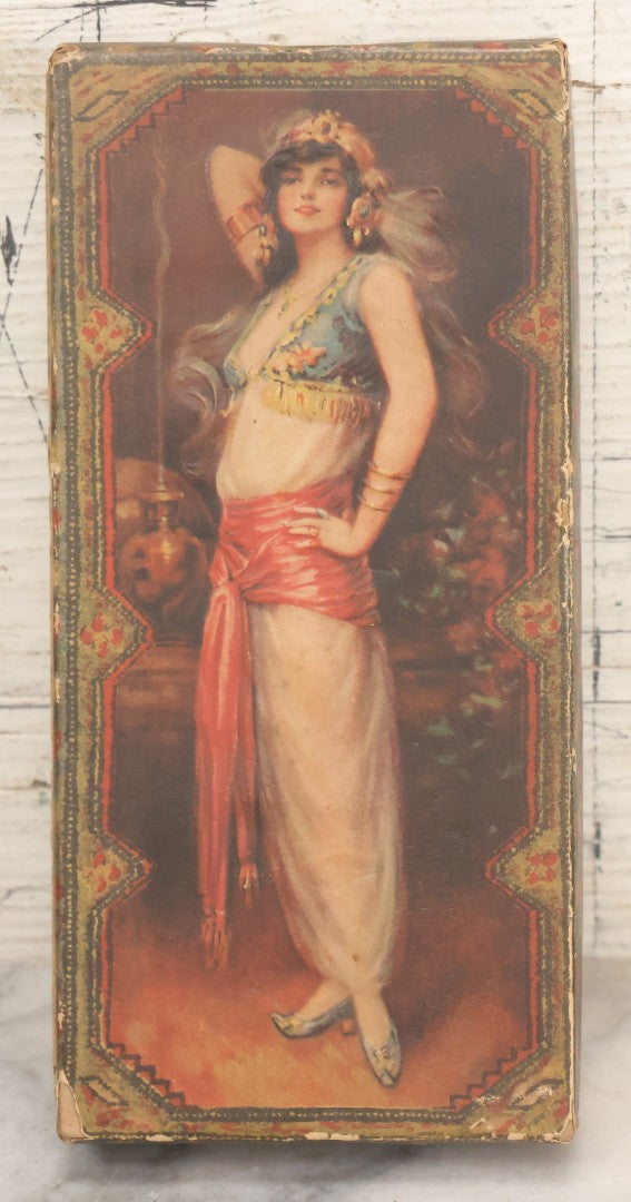 Lot 105 - Antique Paper Board Candy Box With Lithograph Wrapped Lid With Exotic Woman Graphics, Paper Label On Bottom From G.B. Co., Springfield, Massachusetts