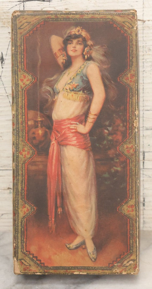 Lot 105 - Antique Paper Board Candy Box With Lithograph Wrapped Lid With Exotic Woman Graphics, Paper Label On Bottom From G.B. Co., Springfield, Massachusetts