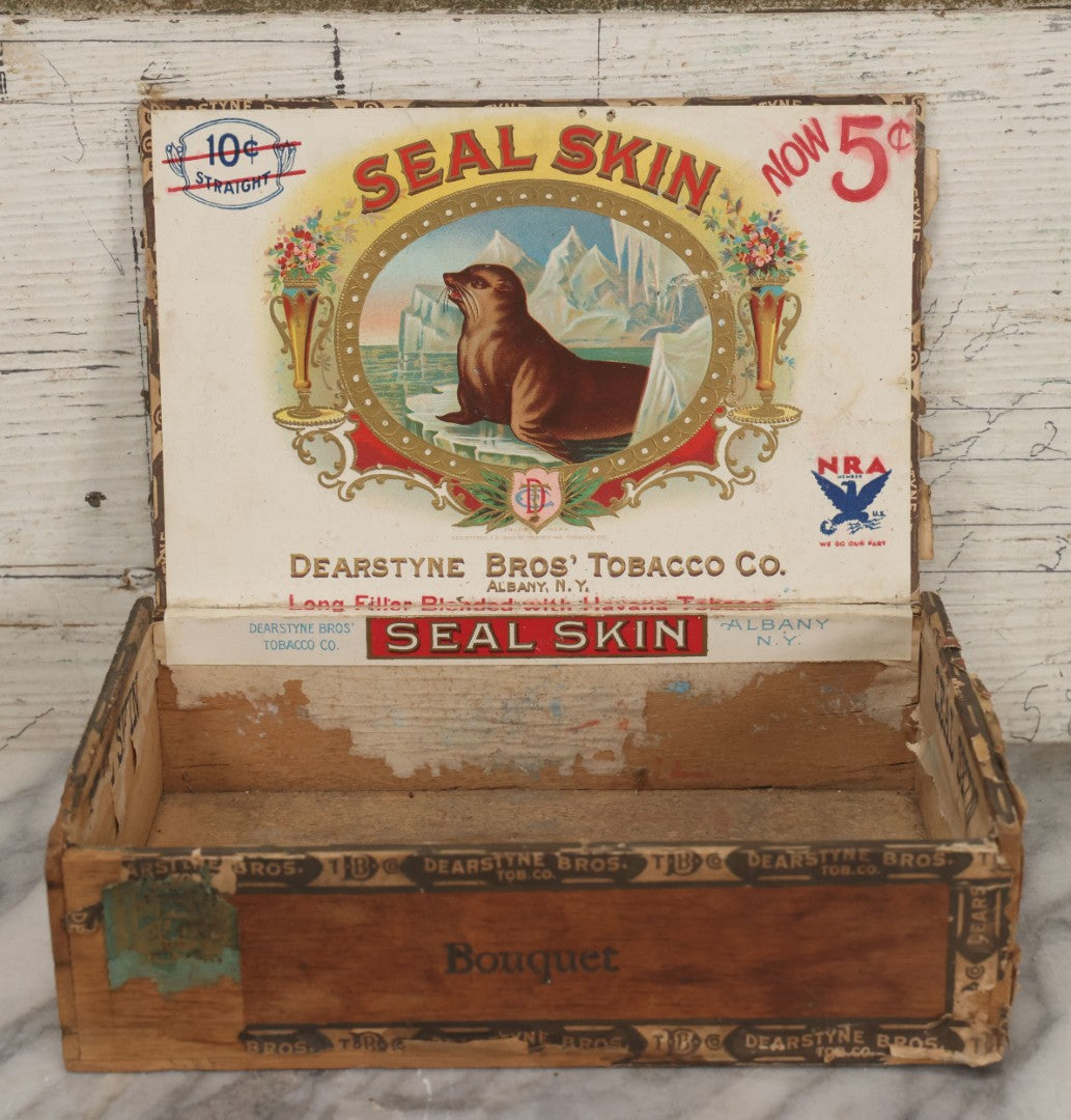 Lot 115 - Antique Wooden Cigar Box For "Seal Skin" Cigars, Manufactured By Dearstyne Bros. Tobacco Co., Albany, New York, With Lithographed Interior And Exterior Labels With Arctic Seal Graphics