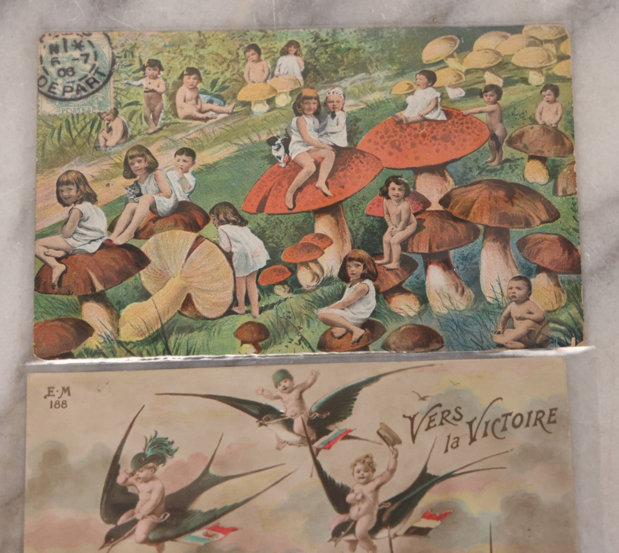 Lot 107 - Grouping Of Three Antique Foreign Postcards Of Children And Cherubs In Fantastical Scenes Including Flying On Birds, Napping On The Moon, And Sitting On Giant Mushrooms