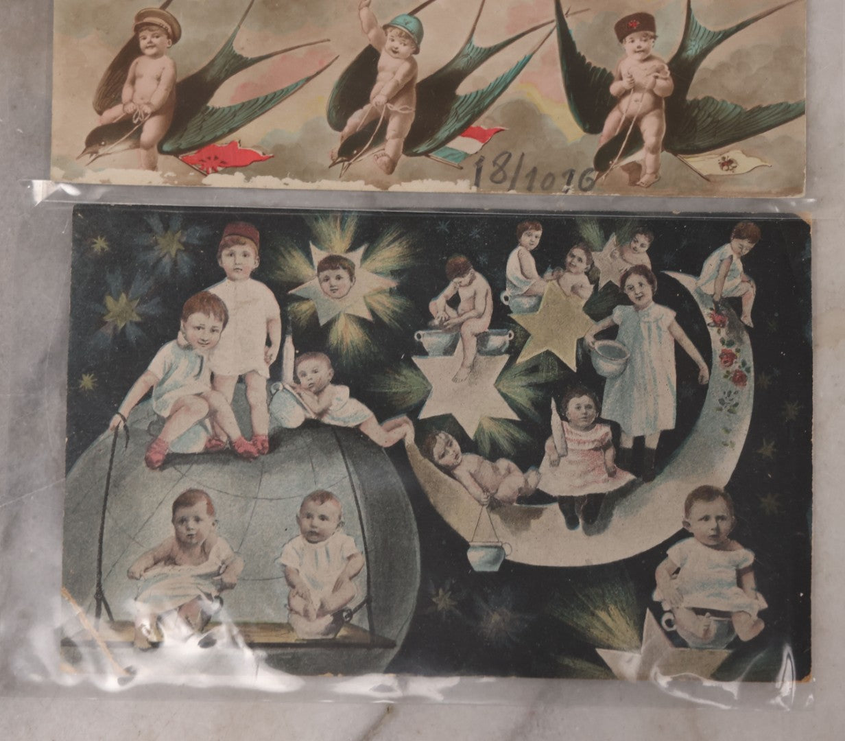 Lot 107 - Grouping Of Three Antique Foreign Postcards Of Children And Cherubs In Fantastical Scenes Including Flying On Birds, Napping On The Moon, And Sitting On Giant Mushrooms