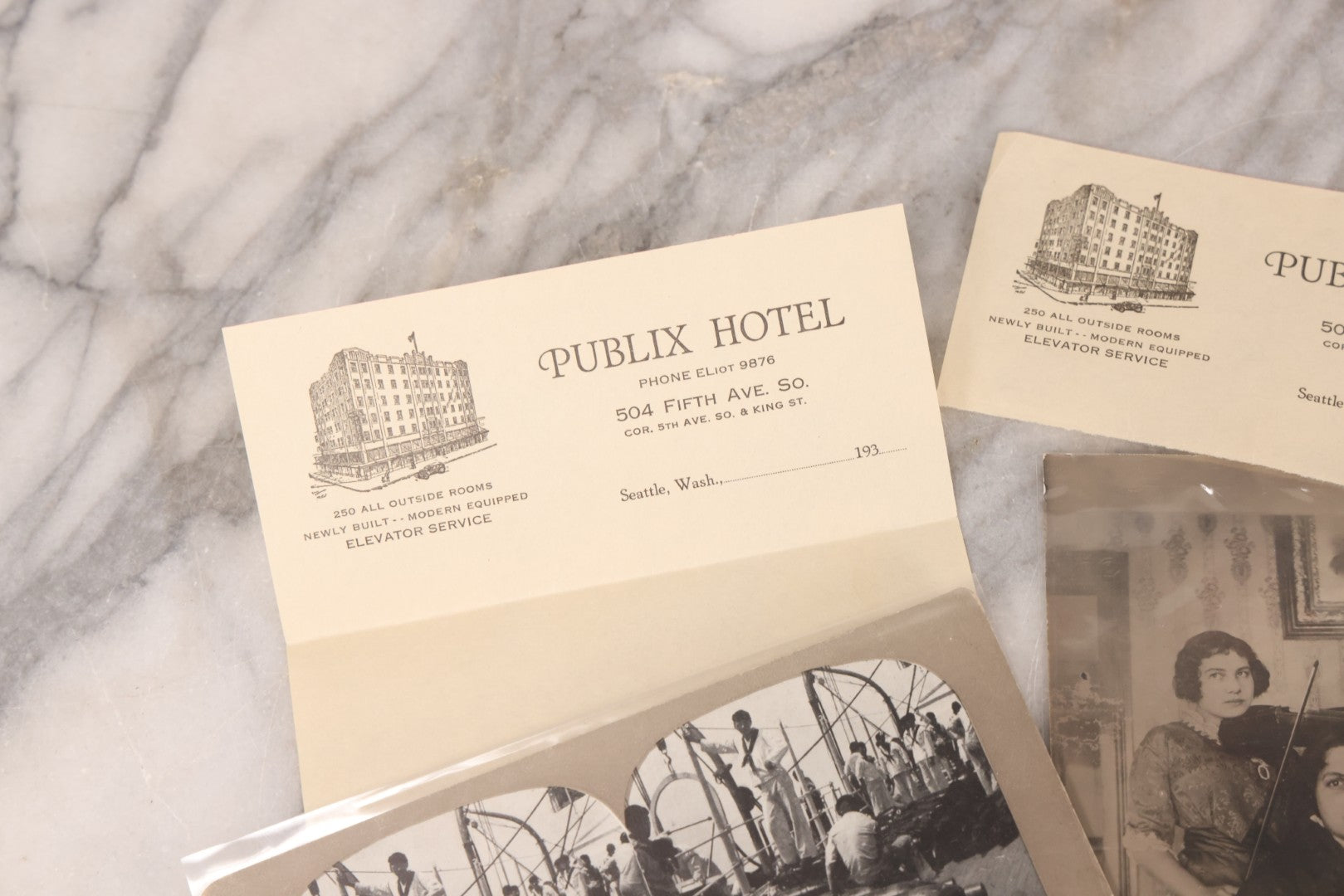 Lot 110 - Nine Piece Vintage And Antique Ephemera Grouping Including Real Photo Postcards R.P.P.C. Of Women With Violin, Man In Uniform, Landscape C.D.V. Photograph, Envelopes And Stationary From Seattle Hotels, And Stereoview Of The Deck Of Battleship