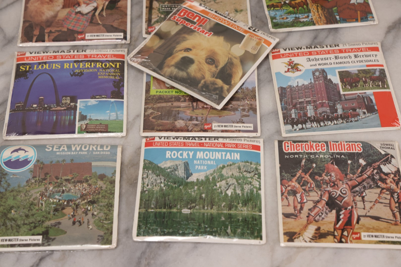 Lot 115 - Thirteen Piece Vintage Sealed Viewmaster Stereoview 3D Discs Including Cabbage Patch Kids, Bambi, Disney On Parade, Smokey Bear, And Many Travel Editions