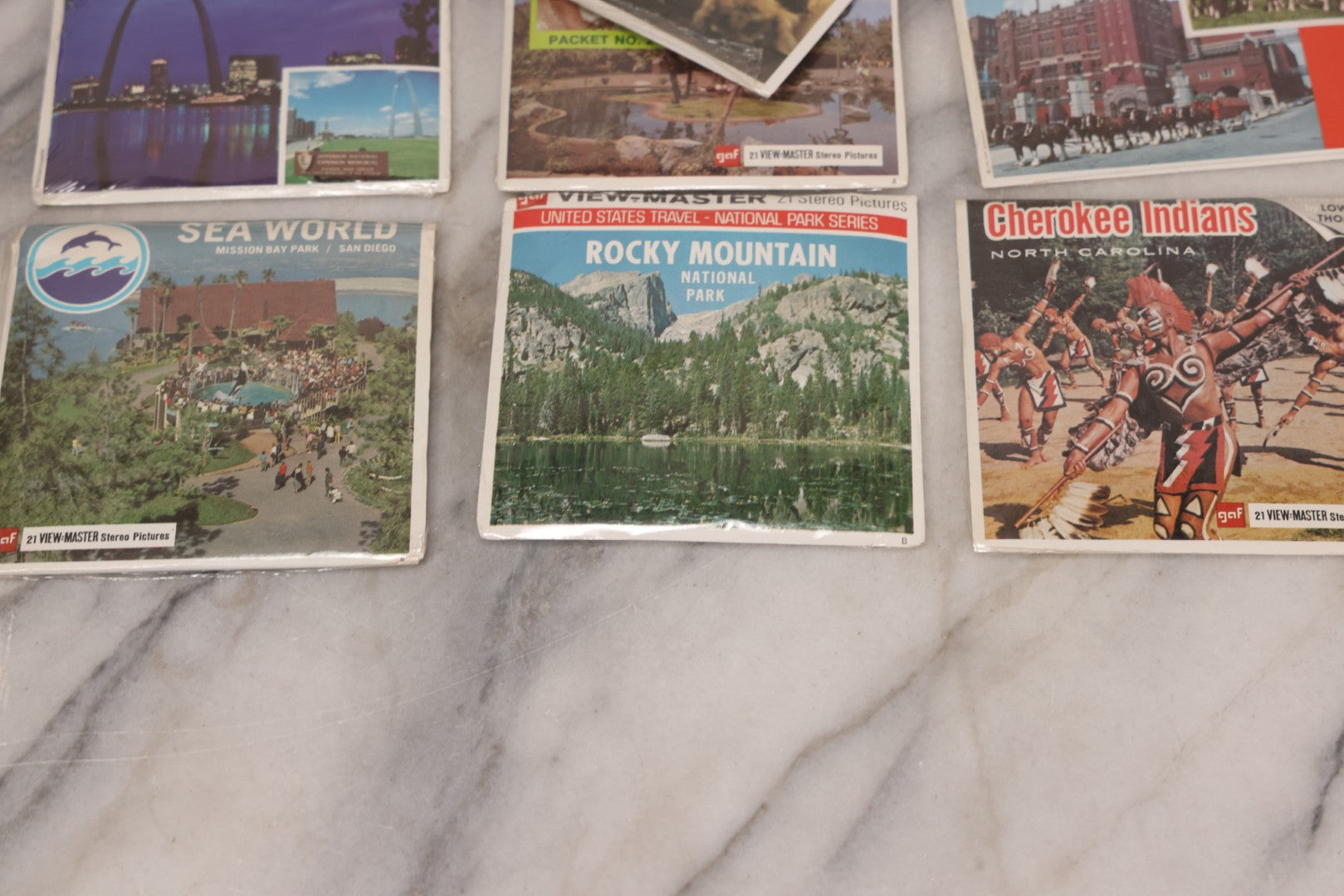 Lot 115 - Thirteen Piece Vintage Sealed Viewmaster Stereoview 3D Discs Including Cabbage Patch Kids, Bambi, Disney On Parade, Smokey Bear, And Many Travel Editions