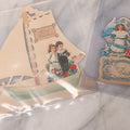 Lot 118 - Pair Of Antique Die Cut Valentines Including Two Girls In Colorful Dresses And Young Couple On Sailboat
