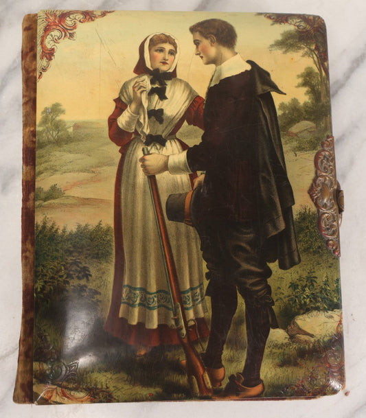 Lot 013 - Antique Victorian Photo Album With Celluloid Cover And Image Of "Courtship Of Miles Standish," Containing 19 Cabinet Cards, Six C.D.V.s And Two Tintypes, Including Two Photos Of Actresses By Jose Mora, Broadway, New York