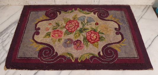 Lot 036 - Vintage Colorful Hooked Rug With Pink Purple And Blue Flowers, Purple Border, Note Wear And Holes, 21-1/2" x 32-3/4"