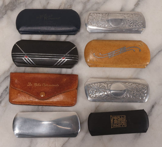 Lot 059 - Grouping Of Eight Vintage And Antique Glasses Cases Including Case With Sunglasses From Dr. Noles Optometrists, Cases From California Optical Co., Dr. Leon Kolb, Decorative Metal Cases, And More