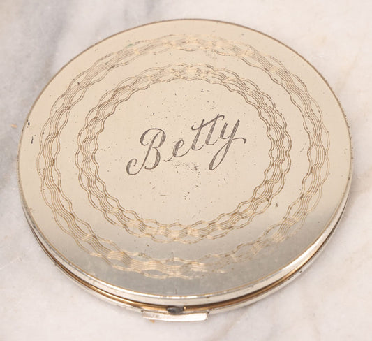 Lot 063 - Vintage Regent Brand Circular Compact With "Betty" Engraved On Lid And Original Pad And Mirror, 4" Diameter