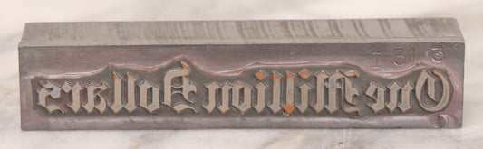 Lot 076 - Vintage Heavy Metal Printing Block For "One Million Dollars"