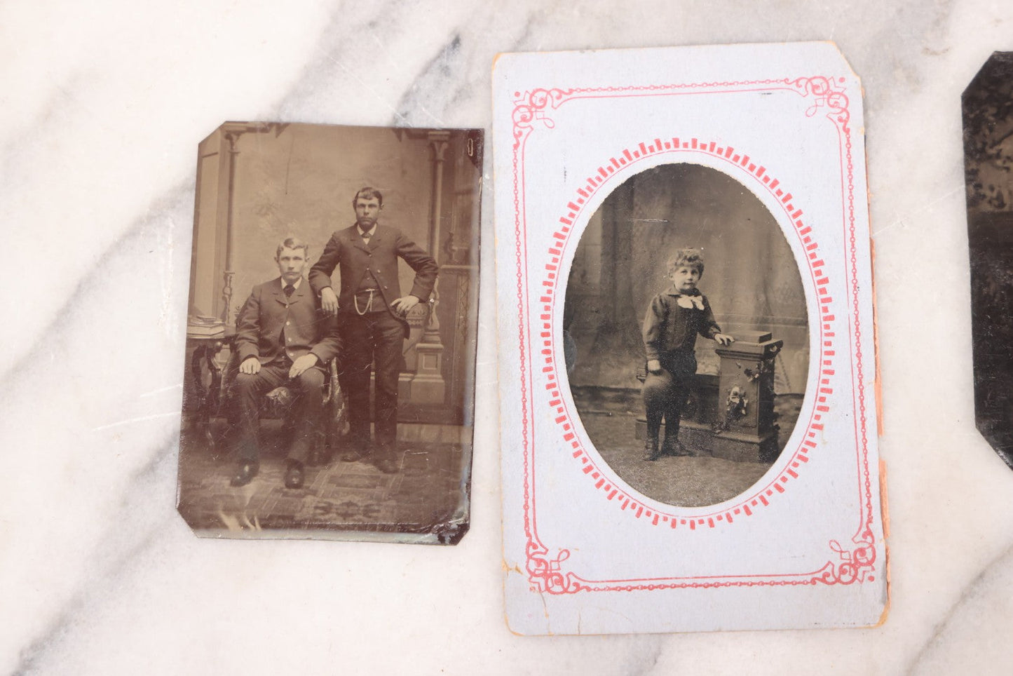 Lot 095 - Grouping Of Sixteen Antique Tintype Photographs Of Men Women And Children Including Two Children In Chairs, Brother And Sister, With Hand Tinting, Young Man Standing With Book, Family Portrait, And More
