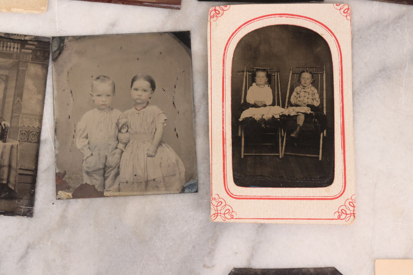 Lot 095 - Grouping Of Sixteen Antique Tintype Photographs Of Men Women And Children Including Two Children In Chairs, Brother And Sister, With Hand Tinting, Young Man Standing With Book, Family Portrait, And More