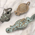 Lot 042 - Grouping Of Three Vintage Replica Cast Brass Roman Style Oil Lamps, Circa Mid Twentieth Century