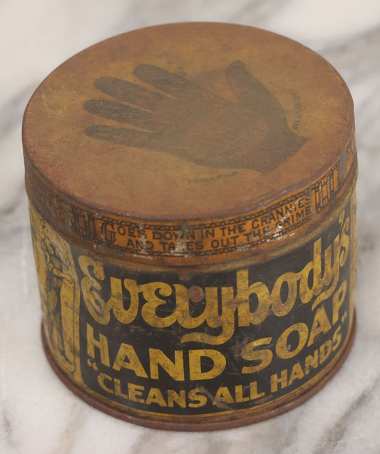 Lot 045 - Vintage "Everybody's Hand Soap" Lithographed Advertising Tin With Black Hand Trademark Graphic, "Cleans All Hands," Everybody's Incorporated, Cambridge, Massachusetts, Dented And Worn As Found, 3" Height