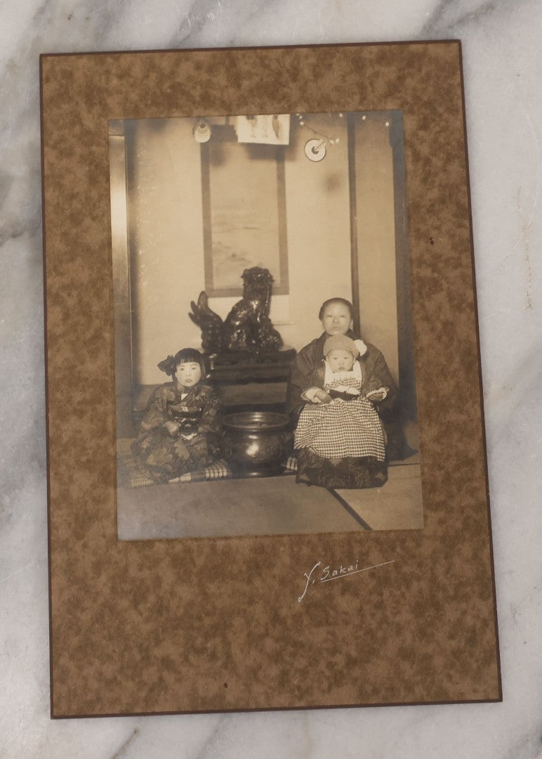 Lot 082 - Antique Boarded Photograph Of Japanese Mother Posing With Her Children In Kimonos, Y. Sakai Photo Studio, Yonezawa City, Japan