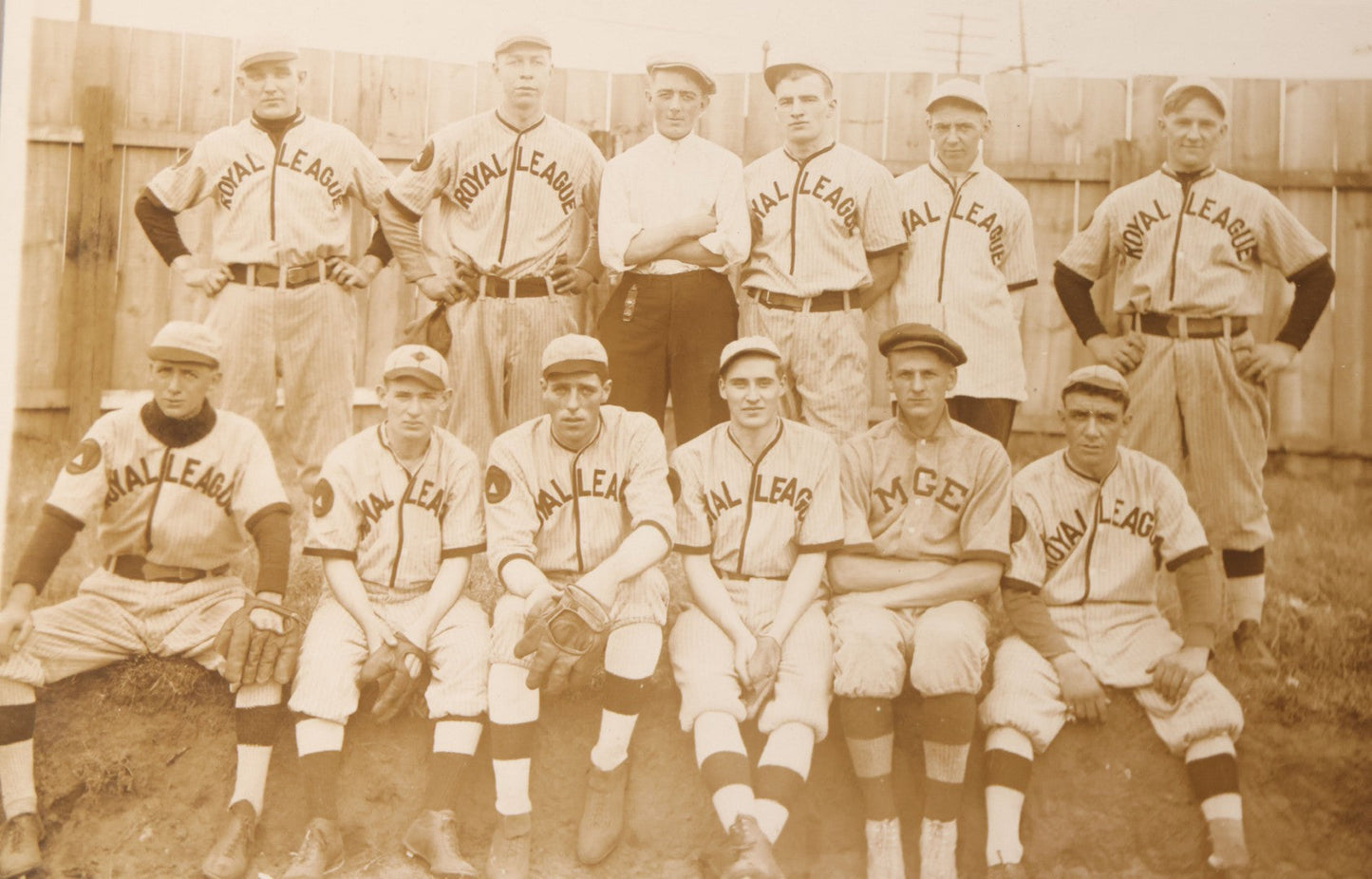 Lot 087 - Antique Boarded Photograph Of Early Baseball Team Wearing "Royal League" Uniforms, Posing With Their Manager And A Man In Plain Clothes