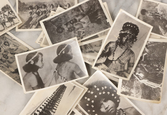 Lot 070 - Grouping Of 26 Vintage Black And White Photographs Of Indigenous Peoples Including Image Of Tattooed Woman And Image Of Tattoo Artist In Practice