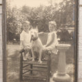 Lot 054 - Vintage Black And White Photograph Of Two Children Posing With Their English Bull Terrier Dog In Yard, In Frame, Framed By Donaldson's, Lowell, Massachusetts, 8-1/8" x 9-7/8"