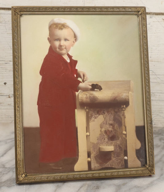 Lot 048 - Vintage Color Tinted Photograph Of A Young Blonde Boy In Sailor Outfit Posing With Toy Car, In Brass Frame, Joseph Puza, Photographer, 8-1/8" x 10-1/8"