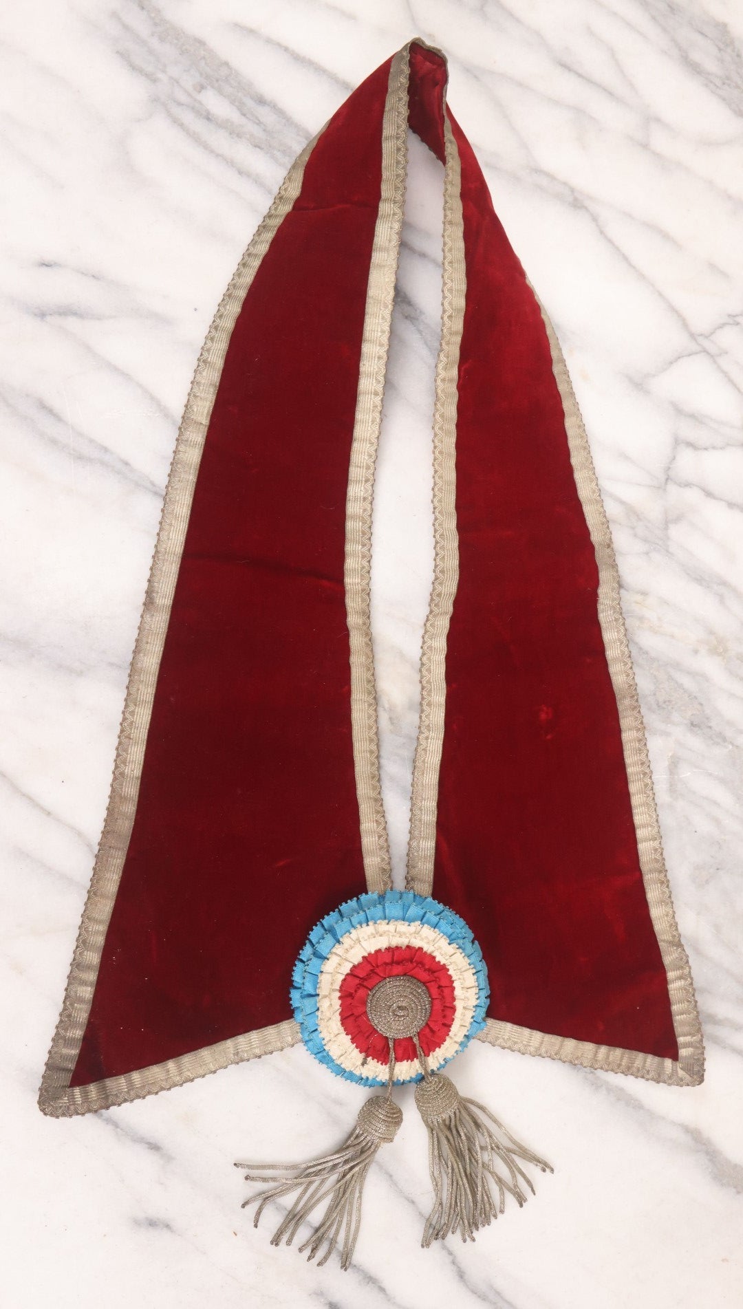 Lot 014 - Single Antique Fraternal Sash Collar With Red Coloring, Red, White, And Blue Fabric Medallion, And Silver Colored Tassels