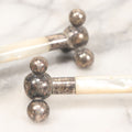 Lot 037 - Pair Of Antique Silverplate And Mother Of Pearl Knife Rests, 3-1/2" Long Each