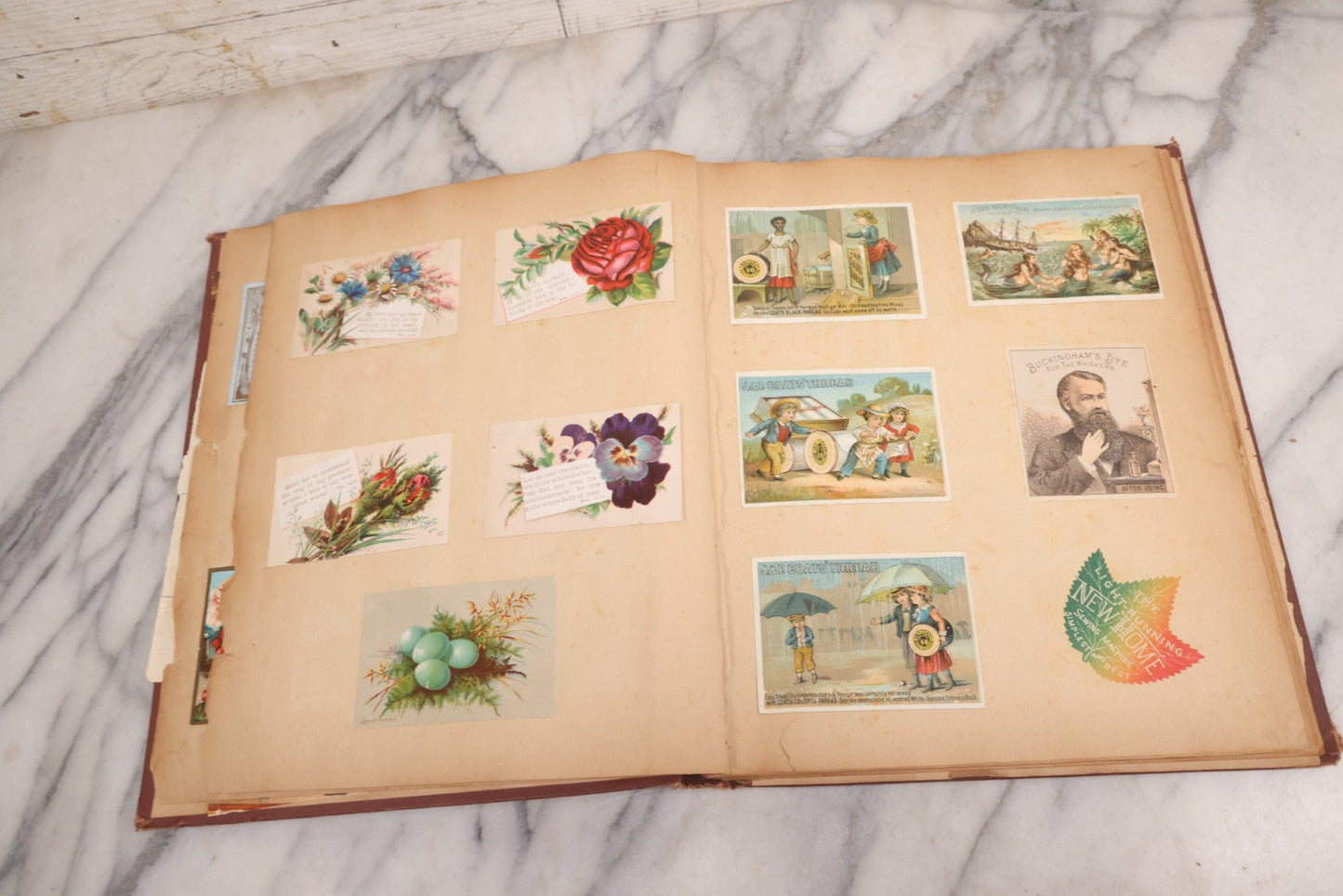 Lot 114 - Antique Victorian Scrapbook Album With Textured Urns On Cover Containing 70+ Pieces Including Trade Cards, Die Cuts, Calling Cards, And Other Scraps